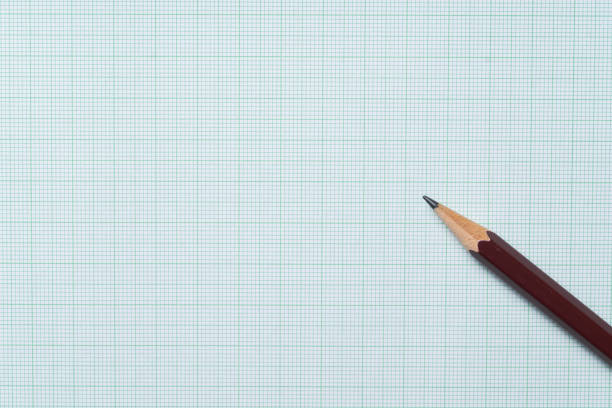 Small pencil next to a protractor on top of graph paper. Measuring instrument, with writing instrument and paper.