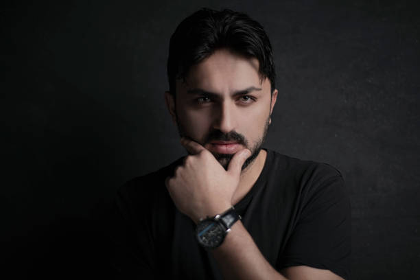 istock Studio portrait of a handsome man posing against a dark background. 1329530127