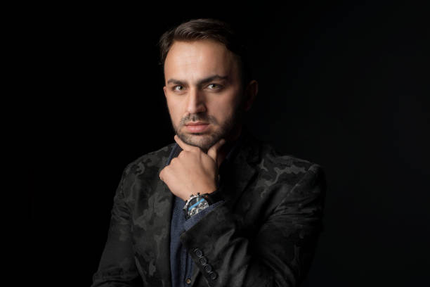 istock Studio portrait of a handsome man posing against a dark background. 1329531034