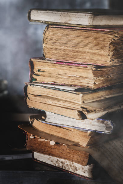 istock A large pile of old books and evening light. 1329532588