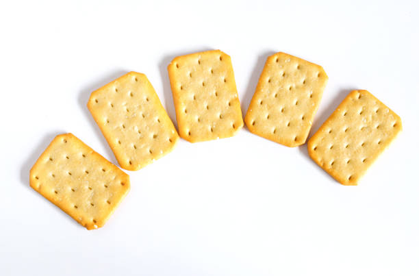 istock Dry cracker cookies or biscuits on background, concept of food. 1329533472