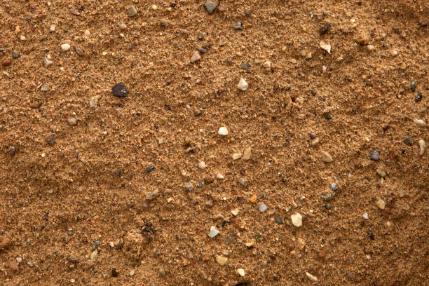 istock Fine sand with stones for tracks, beautiful background 1329534180