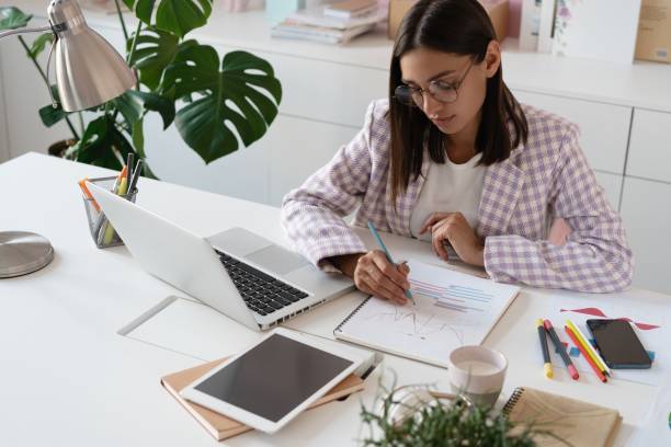 istock Indian mixed-race beautiful businesswoman working on a new project on her workplace using laptop at the office. 1329535780