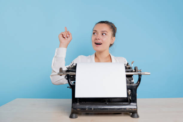istock happy young woman writer experiences inspiration and delight. 1329539606