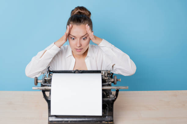 istock The author at the typewriter, a young woman writer 1329539639