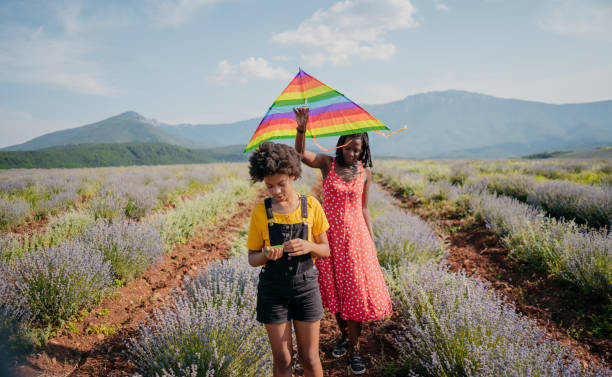 istock Mother and child flying kite together 1329539704