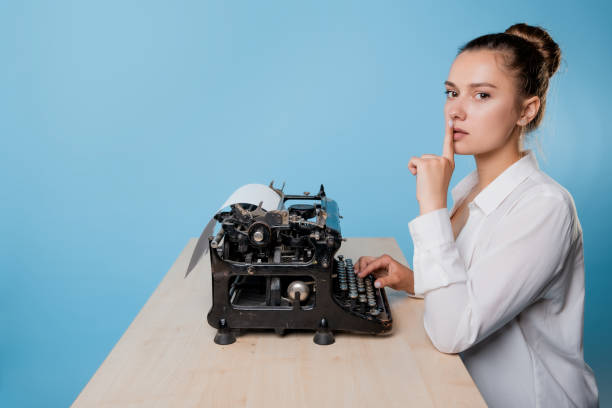 istock The author at the typewriter, a young female writer 1329539711