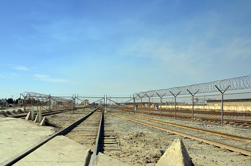 Hairatan,  Kaldar district, Balkh Province, Afghanistan: Hairatan rail freight terminal, terminus of the line, which connects Hairatan to Maulana Jalaluddin Balkhi International Airport in Mazar-i-Sharif -  operated by Uzbekistan's national railway Uzbekiston Temir Yullari - connects with Uzbekistan via the Afghanistan-Uzbekistan Friendship Bridge - Hairatan has developed into one of the most important transshipment centers in Afghanistan.