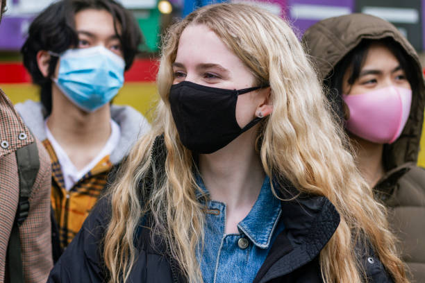 istock Wearing Face Mask When With Friends 1329539912