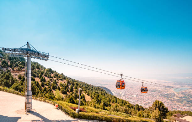 Denizli Aerial tramway Cable Car Denizli , TURKEY - June 19 2021: Denizli Cable Car is a cable car line located in Denizli, Turkey. The cable car is the longest cable car in the Aegean Region with a length of 1,500 meters. It provides transportation to Bagbasi Plateau. The altitude of the lower station reaches 300 meters, and that of the upper station reaches 1,400 meters. denizli stock pictures, royalty-free photos & images