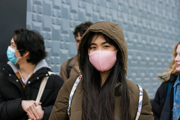 istock Friends Wearing Face Masks 1329540294