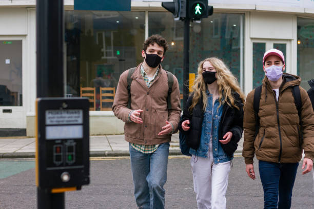 istock Friends Crossing the Road 1329540801
