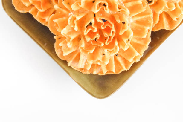Stack of square crackers and Orange is isolated on a white background. Biscuit with Tangerine or clementine slices.