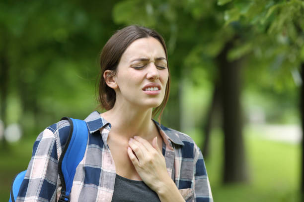 istock Stressed student suffering throat ache in a campus 1329543085