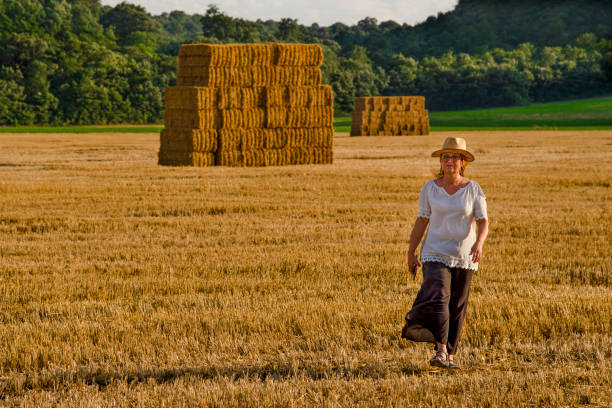istock Woman on the hay field 1329545928