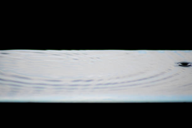istock raindrops ripples on a wet fence during a summer storm macro 1329548355