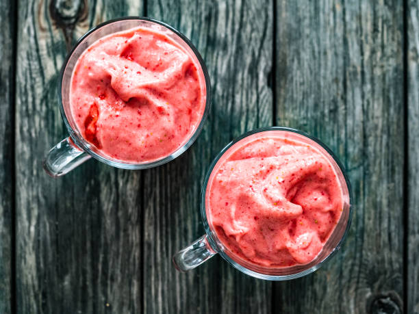 istock Strawberry ice cream on wooden background 1329552665