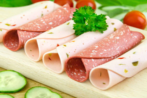 Vegetarian cold meat substitutes on wooden background