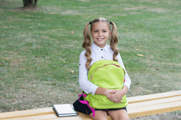 istock Schoolgirl with backpack relax outdoors, when claases over concept 1329553027