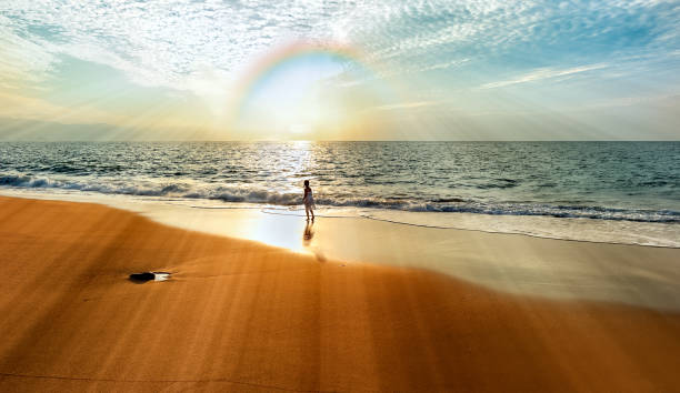 Rainbow Girl Spirit Sunset A Girl Is Standing On The Beach Looking At A Colorful Rainbow With Wonder And Awe religion sunbeam one person children only stock pictures, royalty-free photos & images