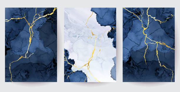 Classic blue watercolor fluid painting vector design cards Classic blue watercolor fluid painting vector design cards. Dusty navy and golden geode frame. Winter wedding invitation. Snow,ice or veil texture. Dye splash style. Alcohol ink. Isolated and editable geode pattern stock illustrations