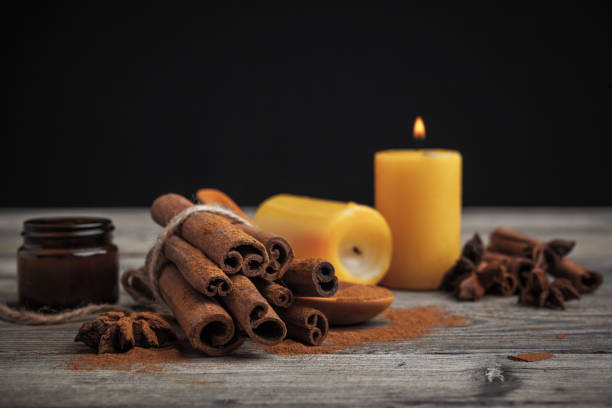 istock Cinnamon sticks on wooden background. 1329560255