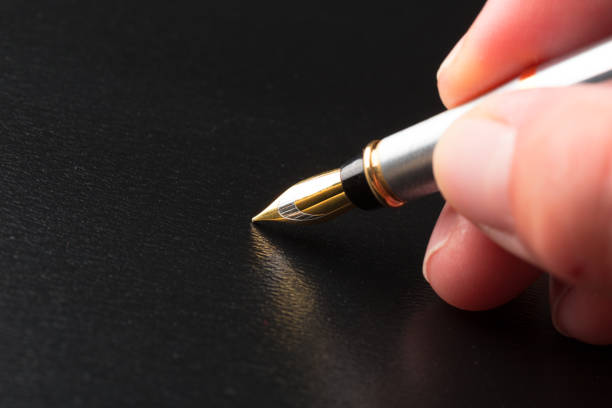 Macro image of a pen nib against a black background