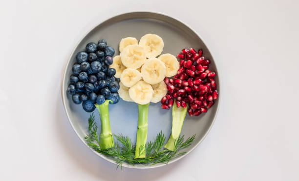 istock food creative ideas, trees made from fruit pieces, breakfast for children 1329561234