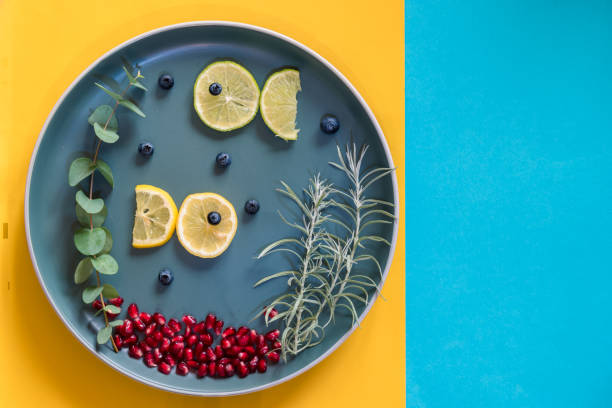 istock food creative ideas, sea fish concept from fruit and vegetables 1329561266