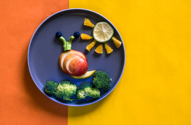 istock healthy breakfast for children, creative ideas from fruit and vegetables, vitamins on plate, copy space 1329561561