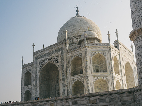 A low angle shot of Taj Mahal in India during the daytime against the sky. Travel concept