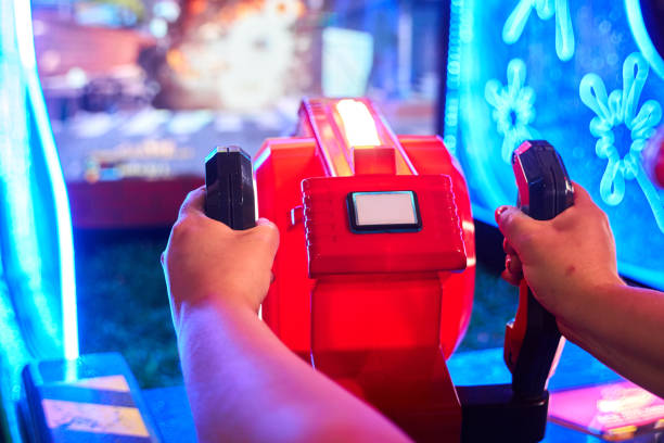 istock woman playing in a video game room 1329564080