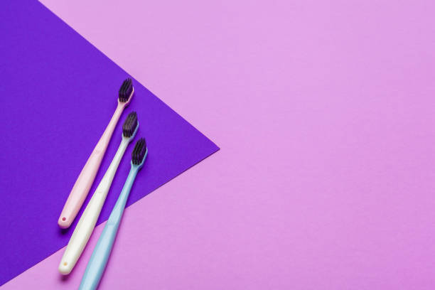 istock Flat lay composition with manual toothbrushes on color background, close up 1329564471