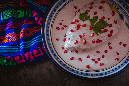 Chile en Nogada on a talavera plate from Puebla, traditional cuisine of Mexico