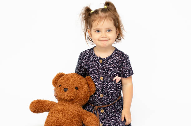 istock A cute little girl embracing teddy bear 1329566603