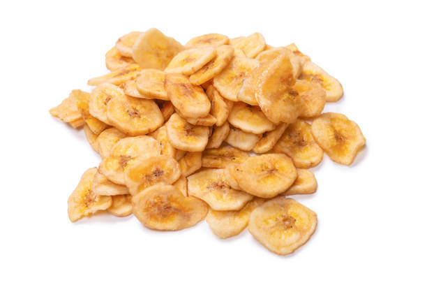 istock Banana chips isolated on a white background. Dehydrated banana. 1329567476