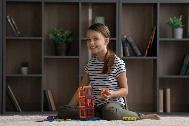 Happy cute girl playing games on heating floor