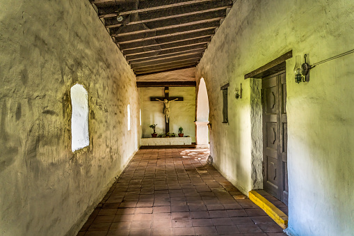 Corridor Crucifix Cross Shrine Mission San Diego de Alcala California.  Founded in 1769 by Junipero Serra, first mission in California