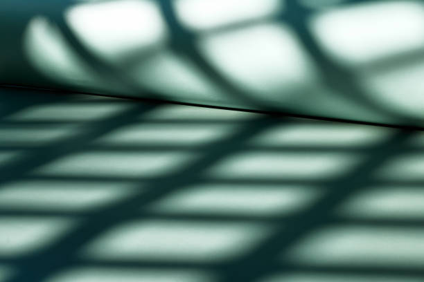 Abstract geometric shadow. Light green monochrome wallpapers. Background for product presentation with shadow and light.