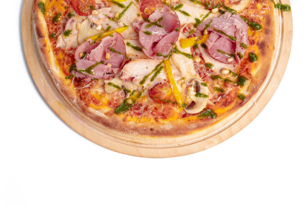 istock Delicious pizza served on wooden plate isolated on white 1329575338