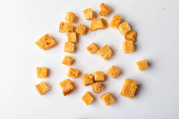 istock Square breadcrumbs. Oven-fried golden brown bread crumbs. 1329575979