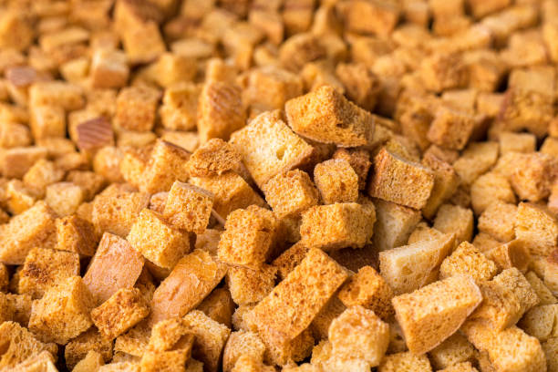 istock Square-shaped bread crumbs. Oven-fried golden brown bread crumbs. 1329576005