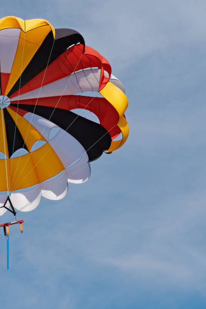 istock Canopy of a multicolor parachute in air. 1329577005