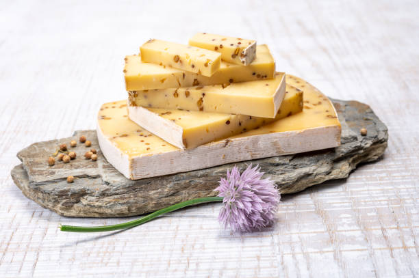 istock Cheese collection, matured cow cheese with mustard seeds from Belgium 1329577559