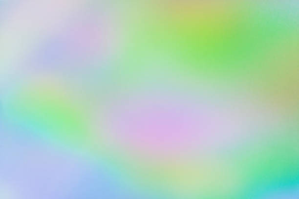 istock Blurred rainbow light refraction texture overlay effect for photo and mockups. Organic holographic flare on a white wall. Shadows for natural light effects 1329578605
