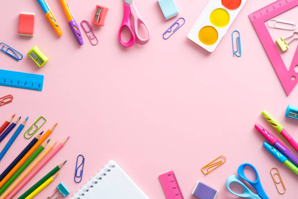 istock Flat lay composition with school stationery on pink background. Back to school concept top view. 1329580896
