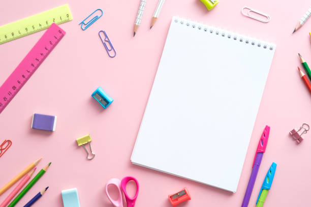 istock Flat lay school supplies and paper notebook on pink background. Back to school concept. 1329580904