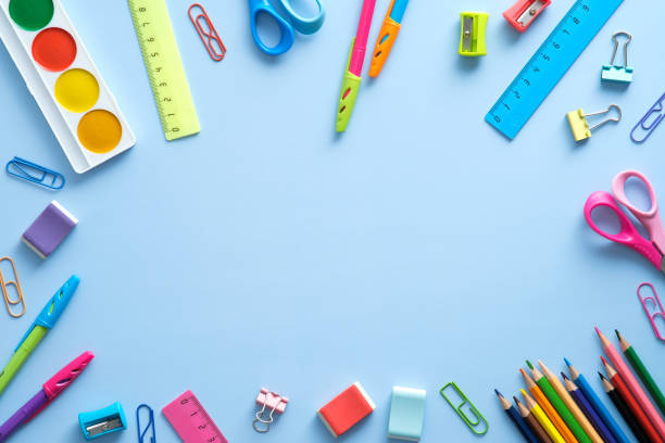 istock Back to school concept. Flat lay school stationery frame on a blue background. Top view, overhead. 1329580982