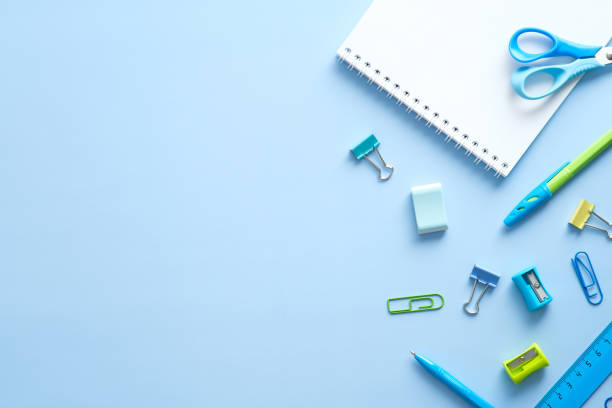 istock Flat lay school stationery on blue desk table. Top view, overhead. Back to school concept. 1329580985
