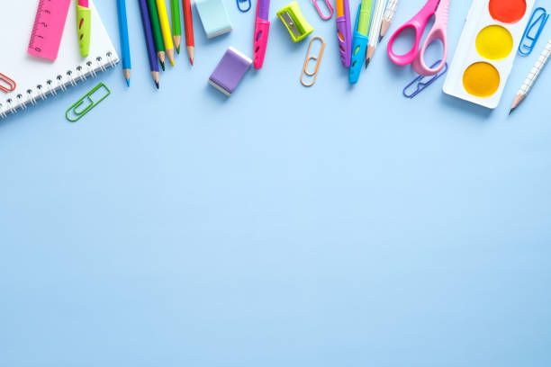 istock School stationery frame border top view. Back to school concept on blue background. Flat lay, view from above. 1329580991